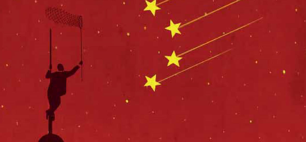 Silhouette of a person on top of a spire set against a red Chinese flag