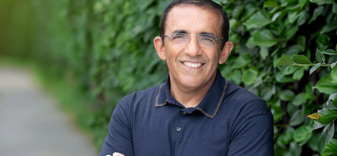Ranjay Gulati in blue shirt with greenery background
