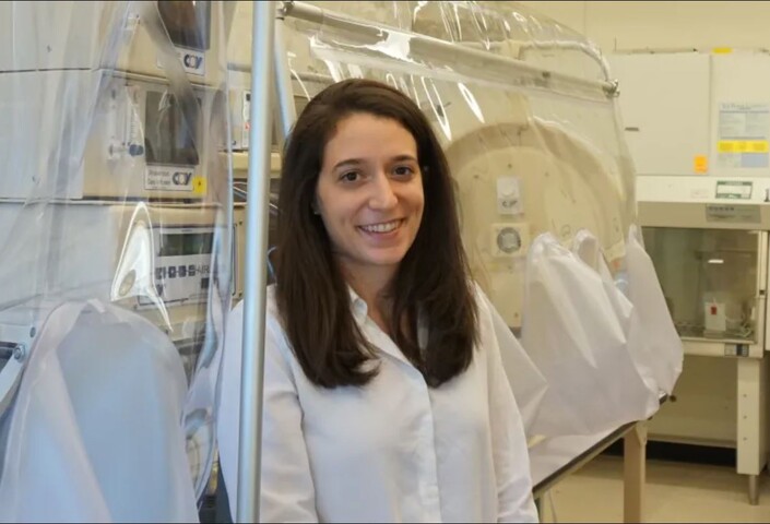 Tami Lieberman in the lab in lab coat