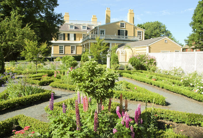 Longfellow house with greenery and gardens in front