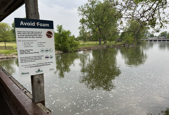 Sign to avoid foam containing PFAS on Huron River