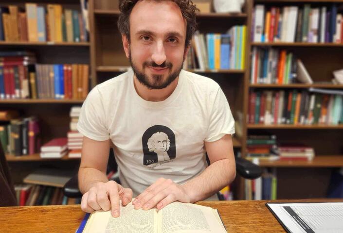PhD student Andrew Koenig at the Harvard English Department's Child Memorial Library, located within Widener Library