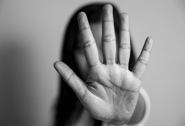 Hand in front of face