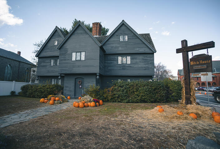 Salem's witch house in fall with pumpkins outside