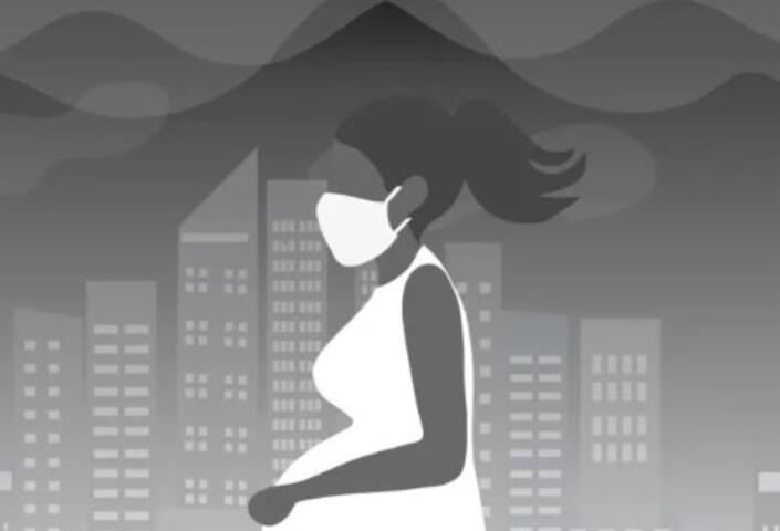 Image of a pregnant woman walking through smog