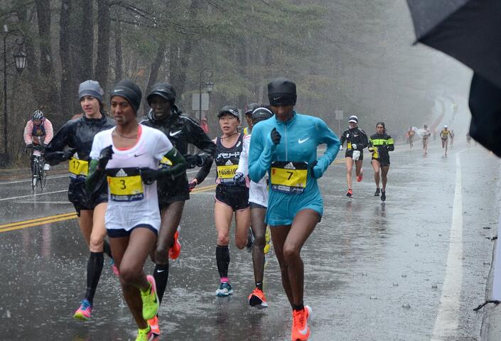 Photo of women running in the rain during the 2018 Boston Marathon