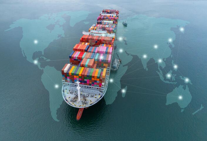 Aerial top view containers ship cargo business commercial logistic and transportation international import export by container freight cargo ship in the open seaport show ocean network on map.