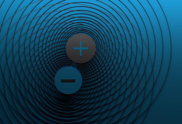 Wide banner with positive and negative charges and symbolic magnetic field on blue background with copy blank space.