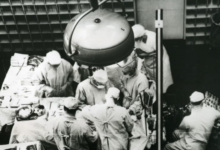 Dr. Joseph E. Murray, at center facing camera, is seen performing the first successful organ transplant on Dec. 23, 1954, at Peter Bent Brigham Hospital in Boston.