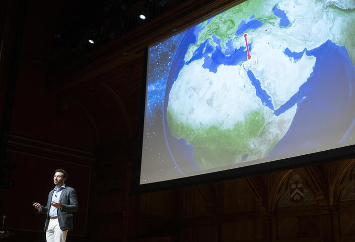 Andrew O'Donohue speaking onstage