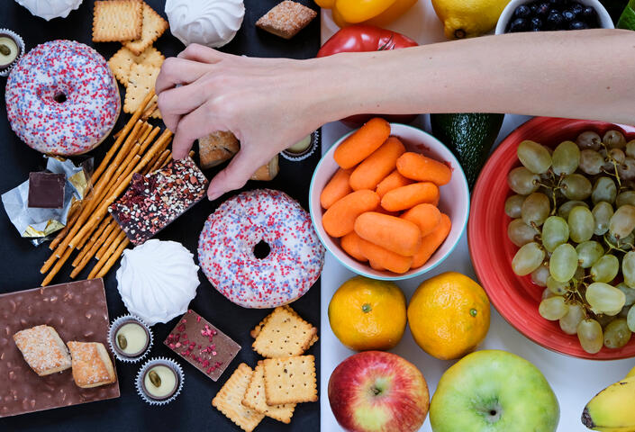 Food tray with hand over it