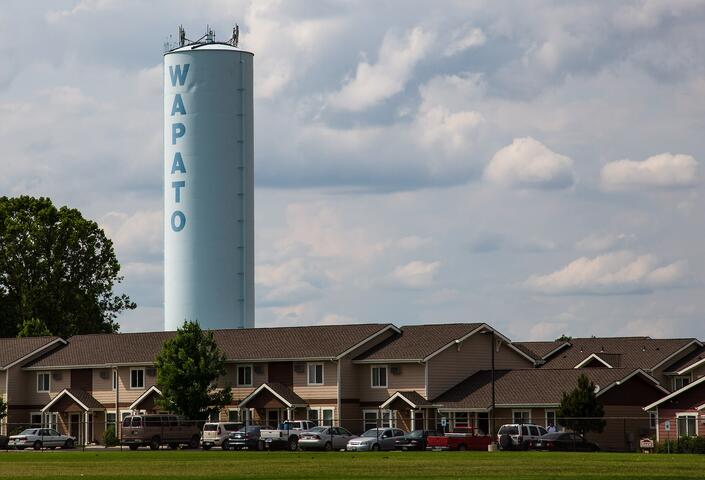 Tower that reads Wapato over rural community in Wapato, Washington