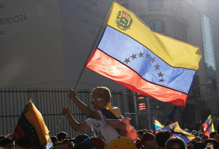 Venezuelan Protest with Flag Waving