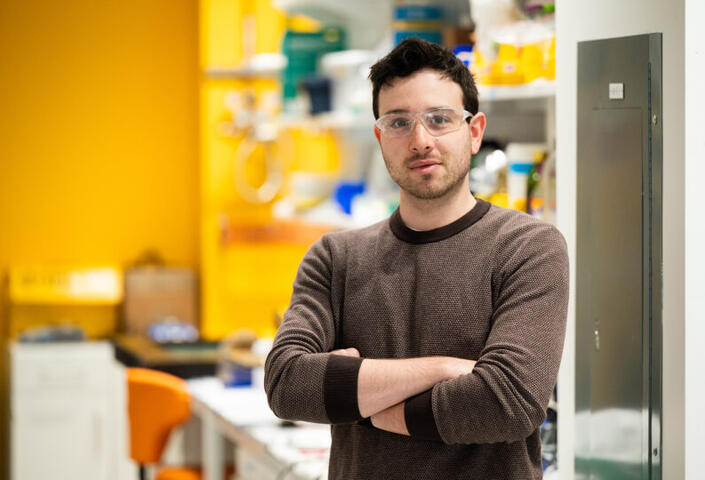 PhD student Raphael Kay in the lab