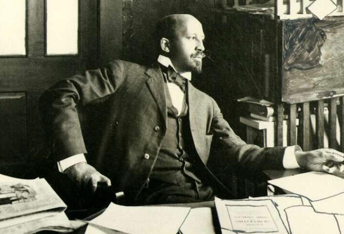 W. E. B. Du Bois, seated at his desk, Atlanta, Georgia, 1909