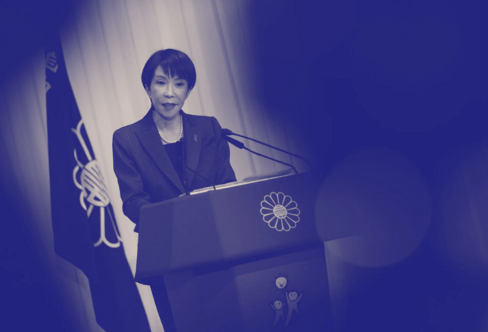 Black and white photo of Sanae Takaich, Japan’s Prime Minister, at a podium