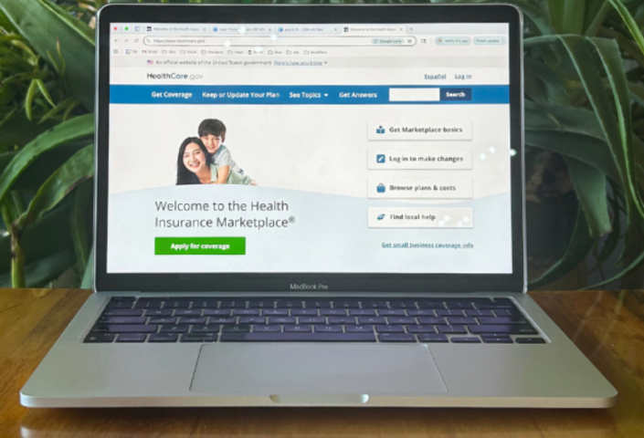 Laptop computer with health insurance enrollment screen