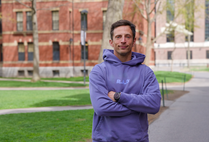 Pawel Pieniazek in a purple sweatshirt that reads, "R.A.D."