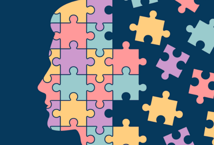 Illustration of a person's head in profile, dissolving into a jigsaw puzzle.