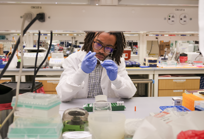 Alton Gayton inside lab wearing lab gear
