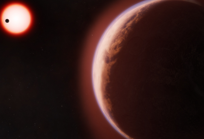 Artist's conceptualization shows the exoplanet LHS 1140 b in the foreground surrounded by a helium-rich atmosphere. In the distance is its red dwarf star orbited by another rocky planet.