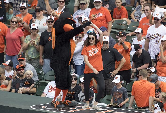 Baltimore Orioles mascot leads fans in a dance