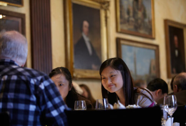 Students at dining table in Harvard's Faculty Club