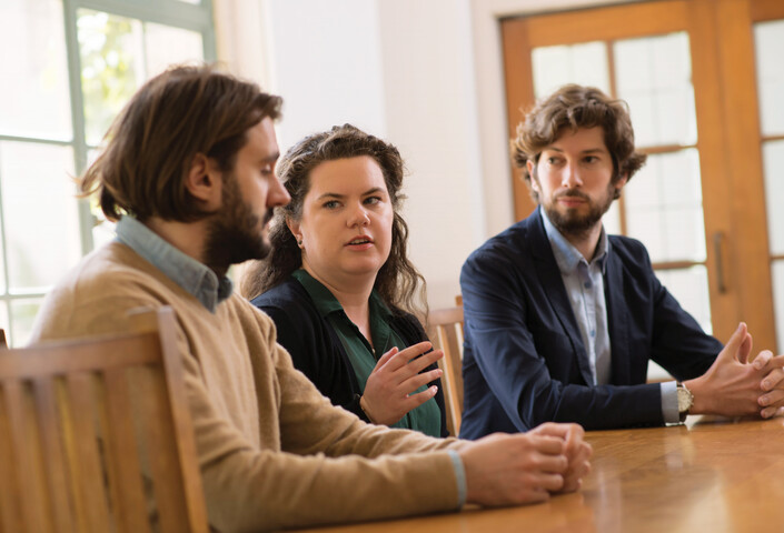 Individuals speaking at roundtable