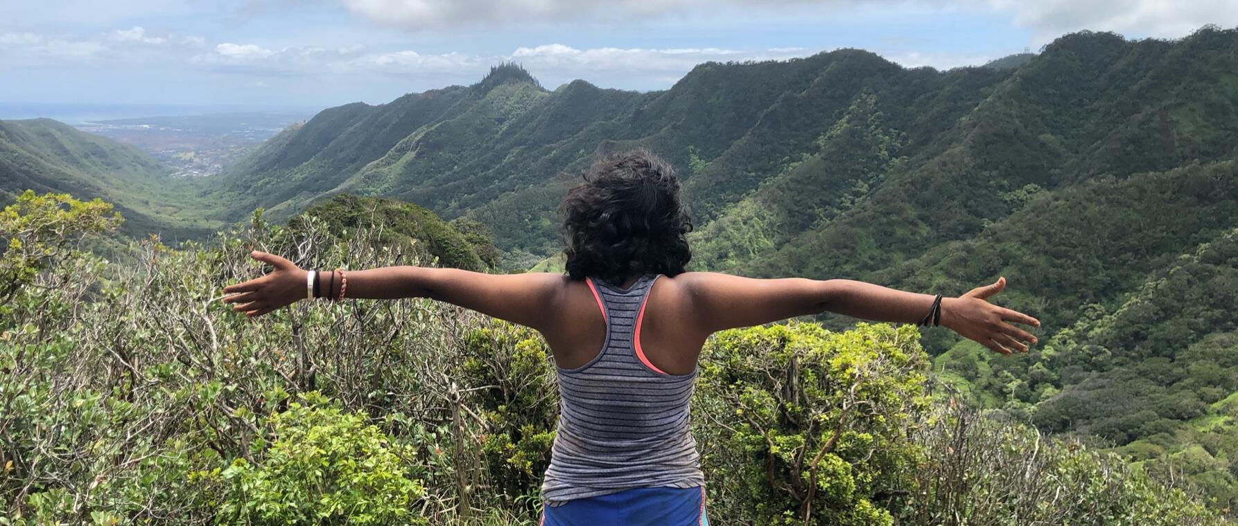 Swathi Srinivasan overlooks mountains in Hawaii