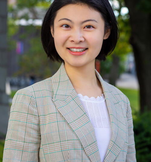 Headshot of Tianwang Liu, Asian woman in suit jacket and long black hair