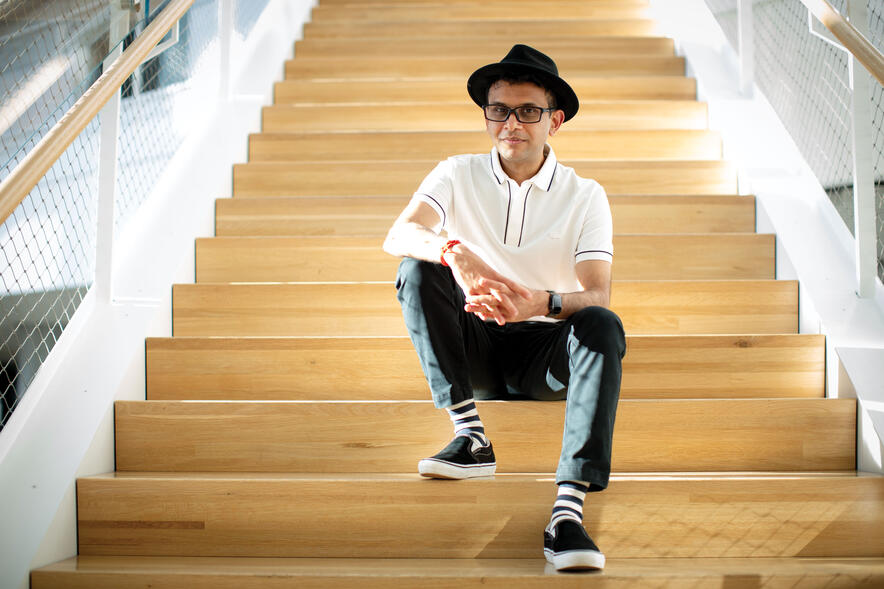 Rohan Murty sitting on stairs