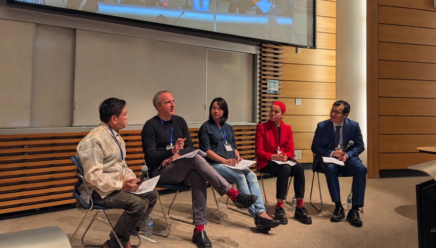 Sian sitting on a panel