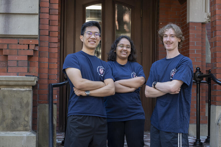 Richards Hall resident advisors stand with arms crossed