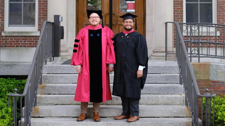 Christofer Rodelo and husband Brian Ventura in front of Mahindra Humanities Center, May 2022 