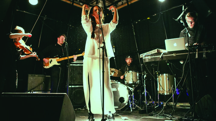 Performance shot of Sasha Siem and her band