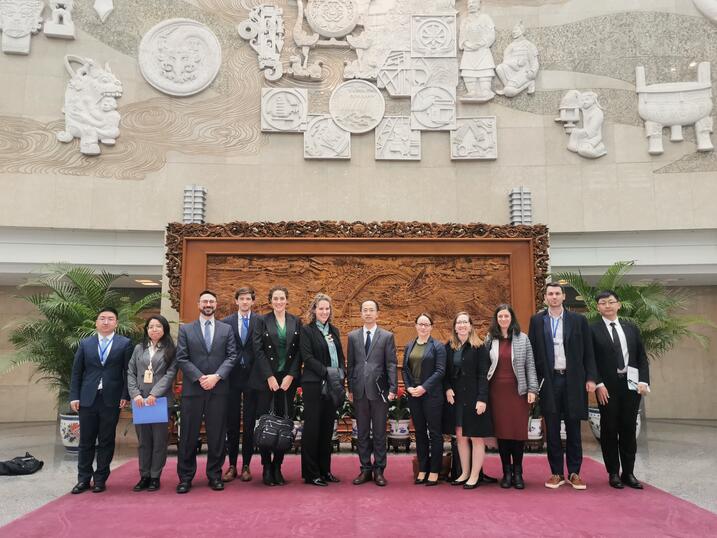 Photo of a delegation from American universities and nongovernmental organizations standing outside of the China Institute of International Studies.