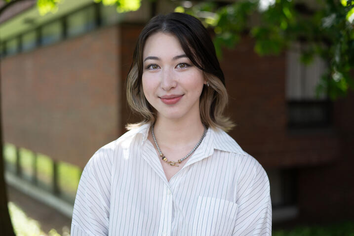 Christina Nikitin headshot; wearing a white blouse