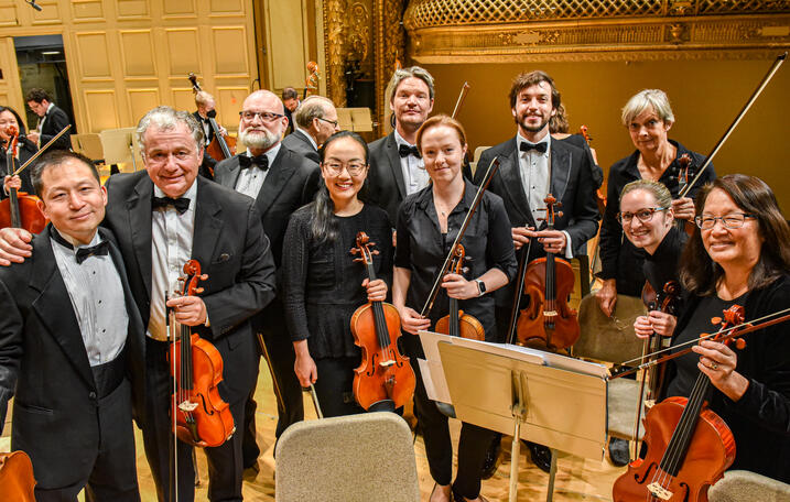 Liu with the viola section after performing in the joint concert World Doctor’s Orchestra and Longwood Symphony Orchestra