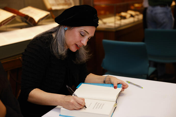 Miriam signing books