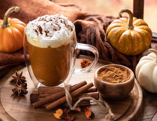 Hot cocoa with pumpkins and fall atmosphere