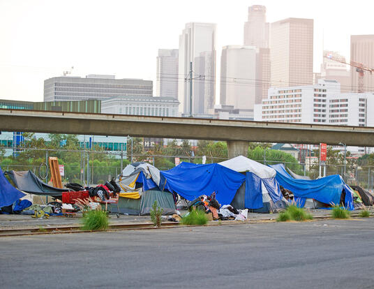 Homeless encampment along the roadside depicting the growing epidemic of homelessness in the City of Los Angeles. Los Angeles, California USA