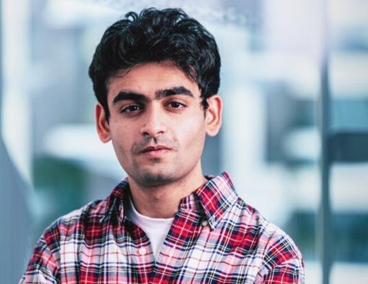 Photo of PhD student Fenil Doshi in the lab