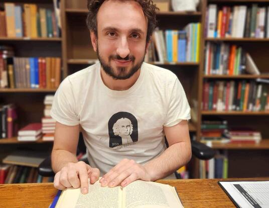 PhD student Andrew Koenig at the Harvard English Department's Child Memorial Library, located within Widener Library