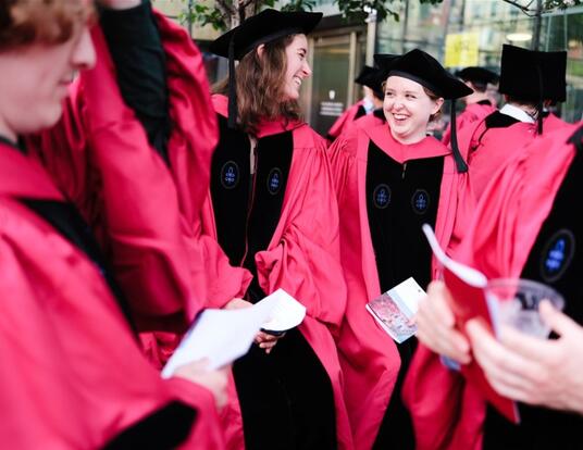 Students in PhD regalia celebrate on Commencement Day in 2024