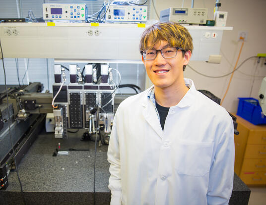 Aric Lu with 3D printer