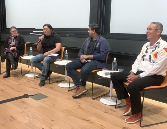 PhD student Robinson Tom speaks at a panel with PhD student Rohan Thakur, Franklin Sage, NTU Graduate Assistant Professor of Dine' Studies, and Kathryn Hollar, SEAS director of community engagement and diversity outreach.