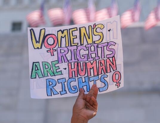 Poster in different colors saying, "Women's Rights are Human Rights"