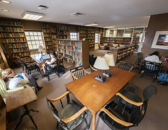 Students and staff sitting in the library of Lehman Hall.