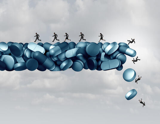 computerized artwork of people standing on piles of pills and falling off