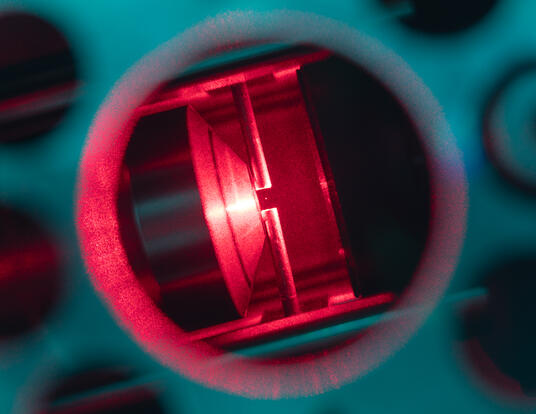 A photograph of a nanoparticle (diameter 103 nm) trapped by an optical tweezer. 